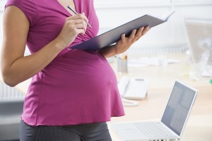 bigstock-Pregnant-Woman-At-Work-Writing-2